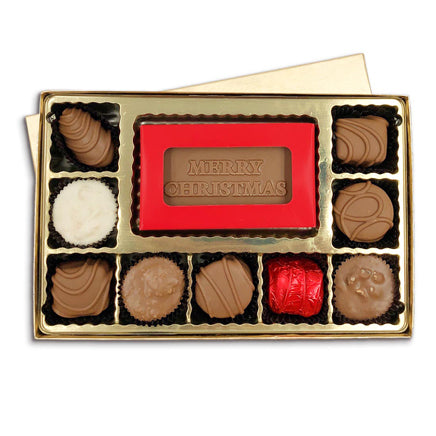 Open box featured chocolate bar with merry christmas text molded on it